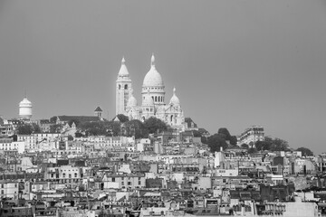 Grayscale shot of Montmartre - a large hill in Paris, France