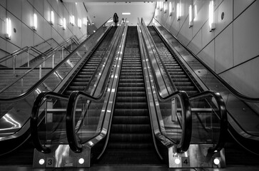 Grey shot of an escalator in the train station - Powered by Adobe