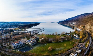Drone shot of the Lake Biel and the city of Biel-Bienne on a sunny day in western Switzerland