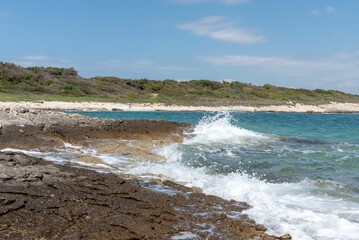 Splashing waves at the rocky coast in Kamenjak