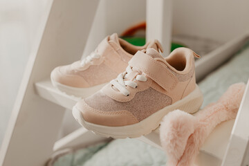 Child's pink sneakers. Cute girl's shoes - 774097559