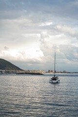 Fototapeta premium Beautiful scenery of a boat in the water in Salerno, Italy