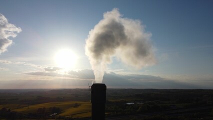 Smoke from a chemical plant and sky on the background