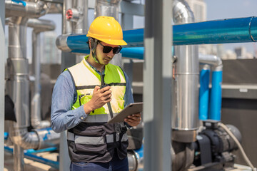 HVAC technician analyzes mechanical, electrical, plumbing systems with energy efficiency plan