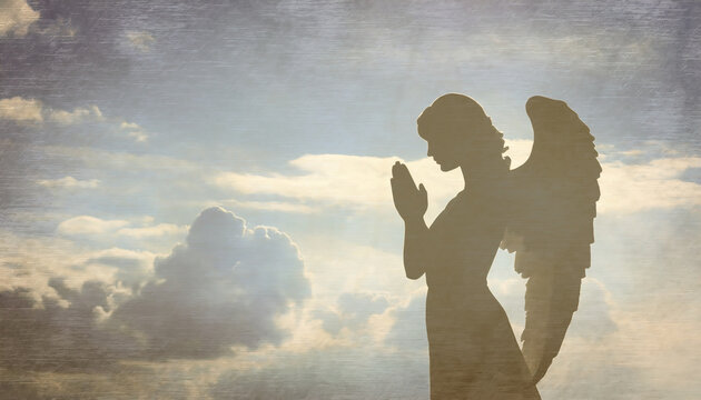 Silhouette of angel praying against blue sky with white clouds background