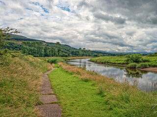 River Roe Flowing Through Lush Green Countryside