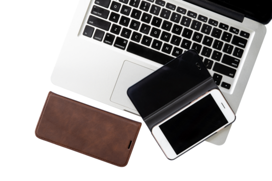 setup of workspace with laptop, wallet and mobile on white background isolated