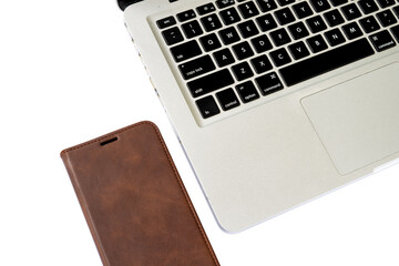 computer keyboard and wallet debit card on white