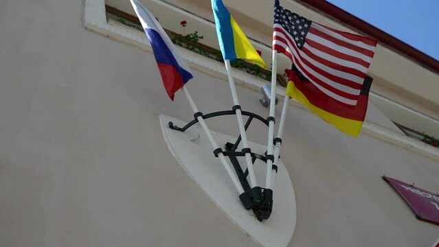 Four flags on building.