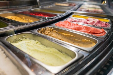 Close-up shot of different flavors of ice cream in a store