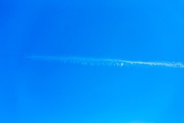 Landscape with beautiful cloudless blue sky background. with a white contrail. Beauty clear cloudy...