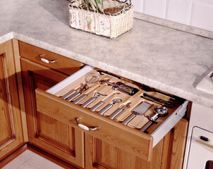 Detail of an equipped kitchen drawer