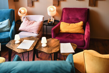 Cozy restaurant with armchairs and cushions for an aperitif - obrazy, fototapety, plakaty