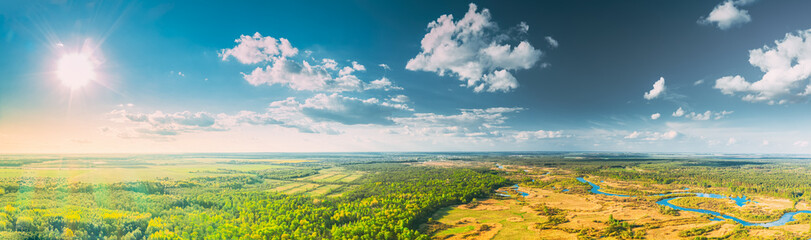 Aerial View Green Forest Woods And River Landscape In Sunny Summer Day. Top View Of Beautiful...