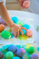 Fototapeta na wymiar Children in Kindergarten Paint Easter Eggs