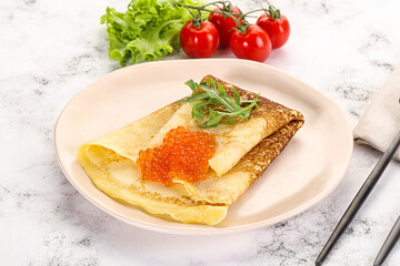 Russian pancake with red caviar