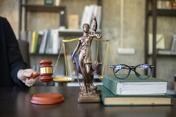 judge holds givel wood tapped on the wooden base to read verdict for victims and defendants to know the verdict obtained from the evidence and the lawyer's defense of the case. court decision concept - obrazy, fototapety, plakaty