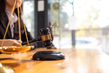 judge holds givel wood tapped on the wooden base to read verdict for victims and defendants to know...
