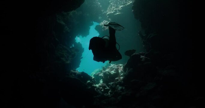 Close up view of a scuba diver in an underwater cave in the red sea.
