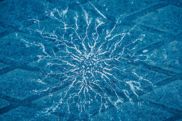 An abstract composition presents water drops scattered across the floor, bathed in a soothing blue...