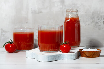 tomato juice in glasses on a white background