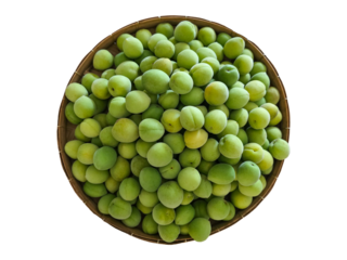 Fresh green plums on a woven basket on a white background. The main ingredient for making plum syrup and plum wine.