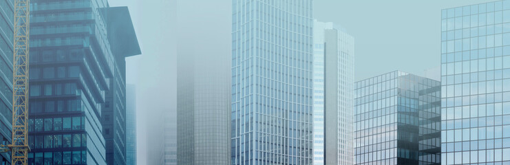 skyscrapers buildings disappear into the mist, creating mysterious and atmospheric urban landscape...