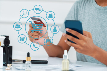 Elegant customer wearing gray shirt controlling device choosing online platform. Smart consumer...