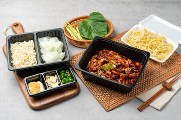 Korean food, webfoot octopus, stir-fry, pork belly, rice, lunch box, shrimp, bean sprout soup, steamed eggs, chili peppers, garlic, radish wraps, flying fish roe, perilla leaf