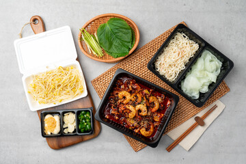 Korean food, webfoot octopus, stir-fry, pork belly, rice, lunch box, shrimp, bean sprout soup, steamed eggs, chili peppers, garlic, radish wraps, flying fish roe, perilla leaf