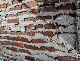 Brick wall with extruded mortar - background