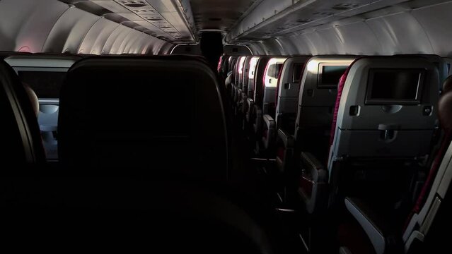 Passenger plane luxury first class interior with the aisle pathway inside plane cabin