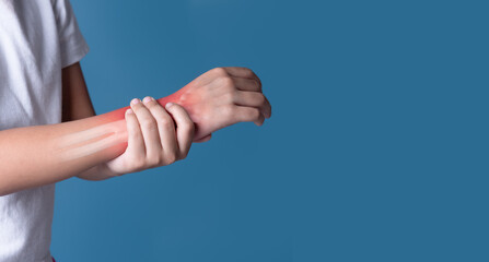 Close up woman holding her wrist symptomatic Office Syndrome. Pain in the joints of the hands(x-ray bone) - 774169135
