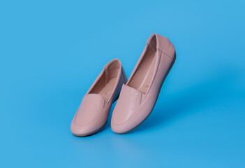 Flats shoes leather on blue background