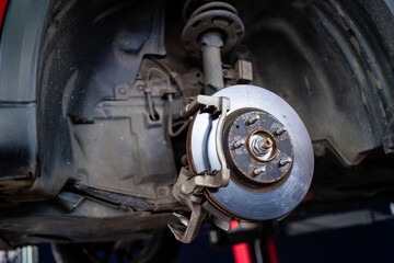 A close up of a car's wheel and tire. The wheel is silver and has a black rim. Concept of...