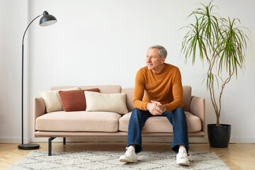 Man sitting on sofa in a cozy living room