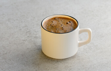 A cup of Turkish coffee made of coffee beans,