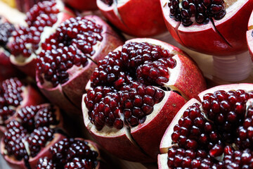 close up ripe red pomegranate fruit cut open  - obrazy, fototapety, plakaty