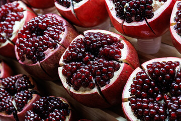 close up ripe red pomegranate fruit cut open 