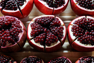 close up ripe red pomegranate fruit cut open  - obrazy, fototapety, plakaty