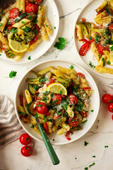 Pasta Primavera, vegetables pasta with zuccini, tomato  and lemon .top veiw.selective focus