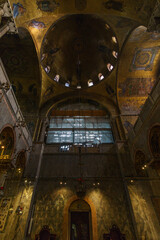 Fototapeta na wymiar Golden wall with beautiful mosaic inside San Marco Basilica, Venice, Veneto, Italy