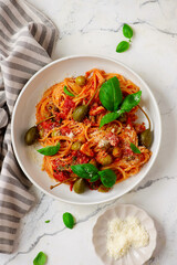 Pasta Putaneska, with  tomato sauce  and basil .top veiw.selective focus