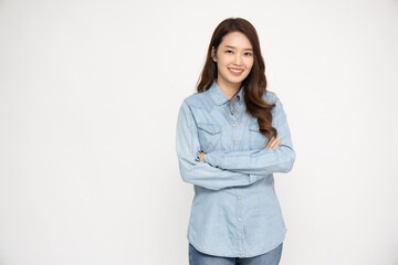 Young beautiful Asian woman in jeans shirt standing and smiling isolated on white background, Looking at camera