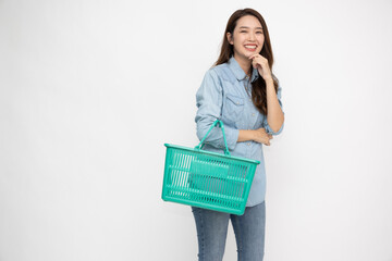 Asian woman in jeans shirt smiling and holding grocery basket isolated on white background, Shopping and Supermarket concept - 774191729