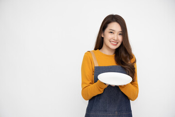 Young food waiter Asian woman holding empty white plate or dish isolated on white background