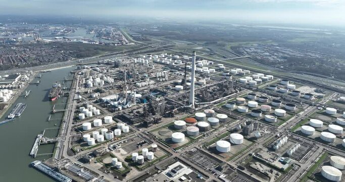 Aerial of large petrochemical complex at Pernis, crude oil is processed into useful products such as gasoline , kerosene , diesel and raw materials for the chemical industry. Aerial drone view, The