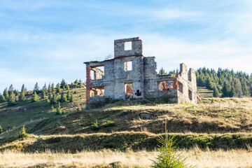 a ruined building in the mountains