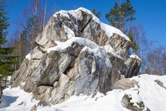 Marble rock in Ruskeala Mountain Park on a sunny March day. Karelia, Russia
