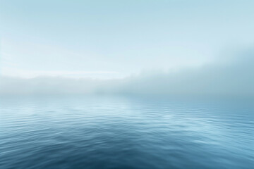 Serene misty lake at dawn.